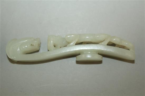 A Chinese white jade dragon belt hook, 18th / 19th century, 11.3cm